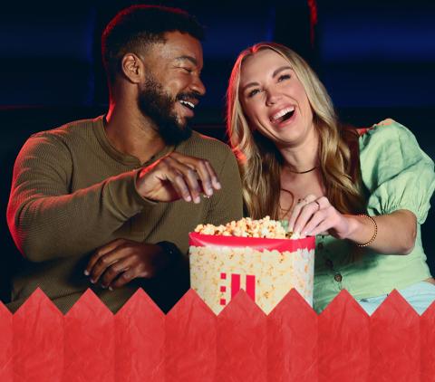 A couple eating popcorn at HOYTS