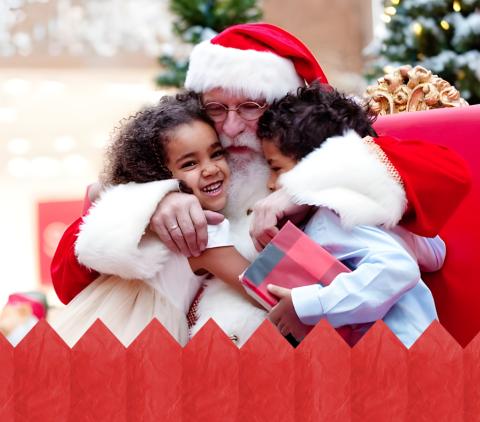 Santa hugging kids