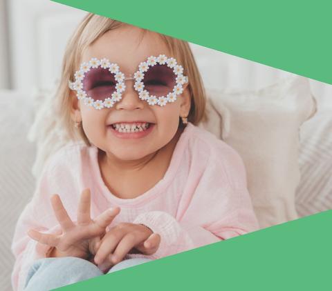 Little girl with flower sunglasses