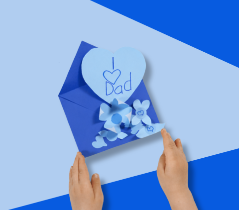 Kid holding Father's Day card