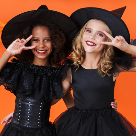 Two girls dressed as witches