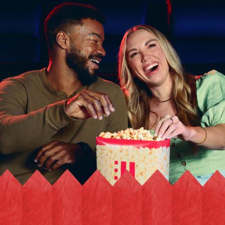A couple eating popcorn at HOYTS