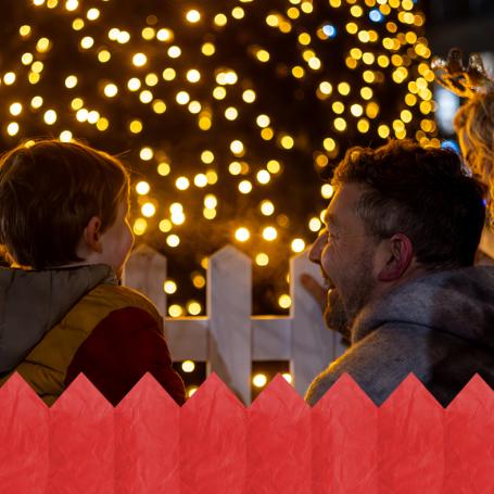 A family looking at twinkly lights