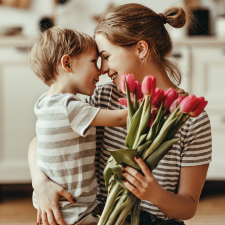 mother and son with flowers