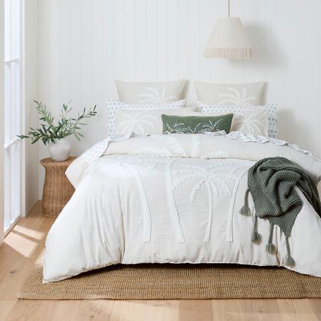 Bed Bath N' Table bedroom set up with quilts and pillows