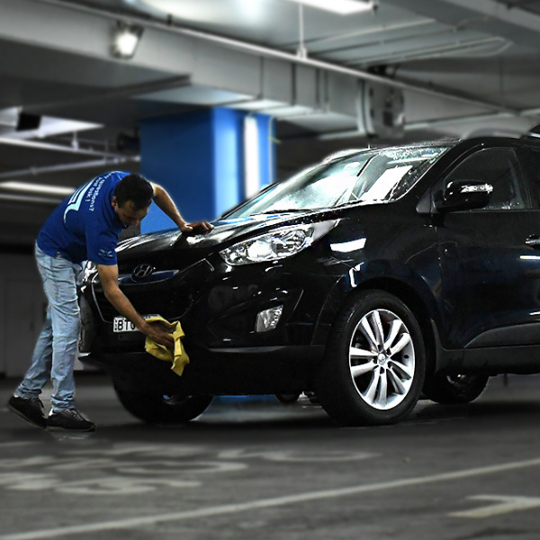 Concierge Car Wash staff washing a car