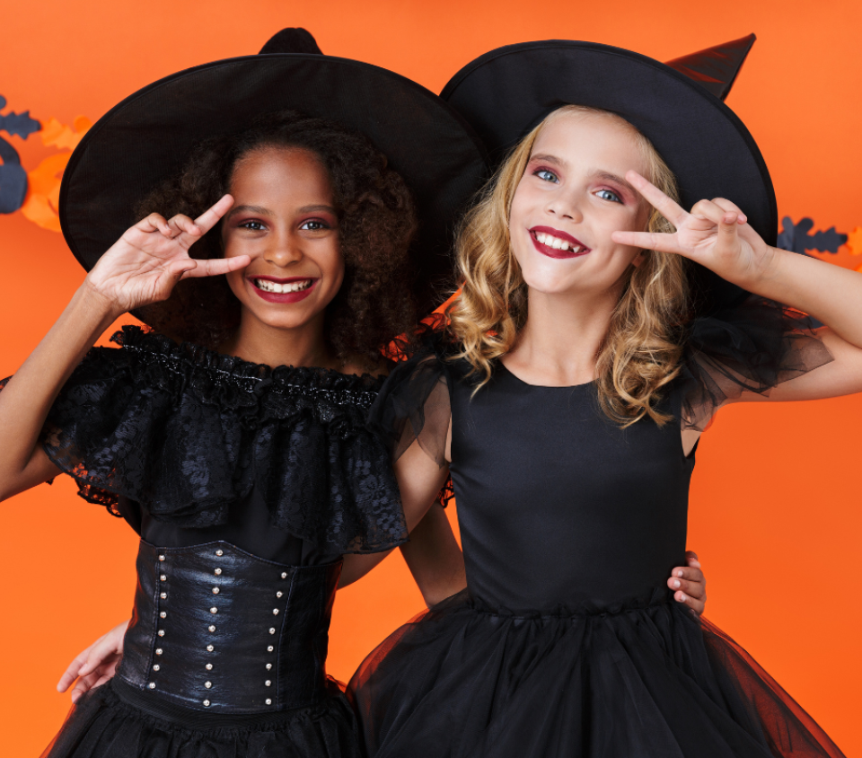 Two girls in Halloween costumes